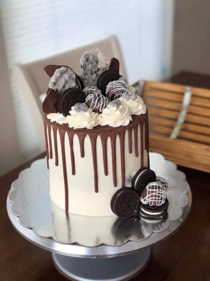 Tall cookies-and-cream drip cake with Oreos and chocolate bark