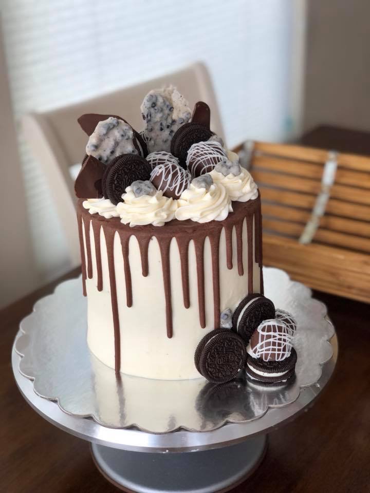 Tall cookies-and-cream drip cake with Oreos and chocolate bark